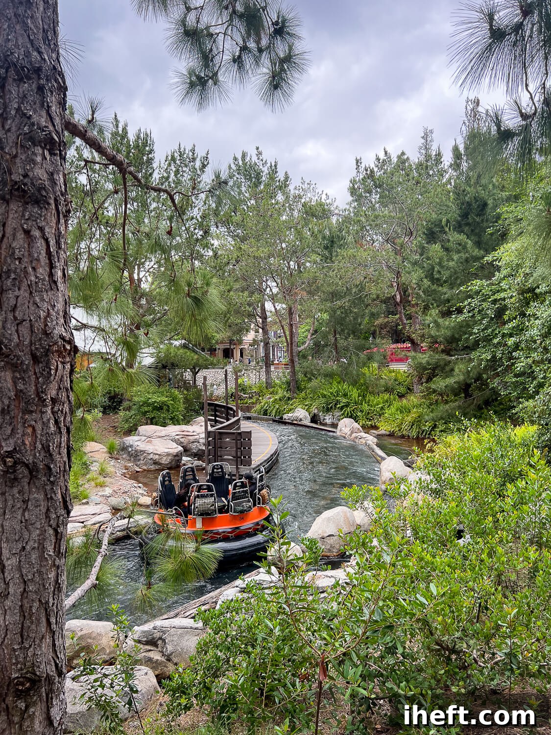 A raft floats down a faux river on the Disneyland California Adventure Grizzly River Run ride. 
