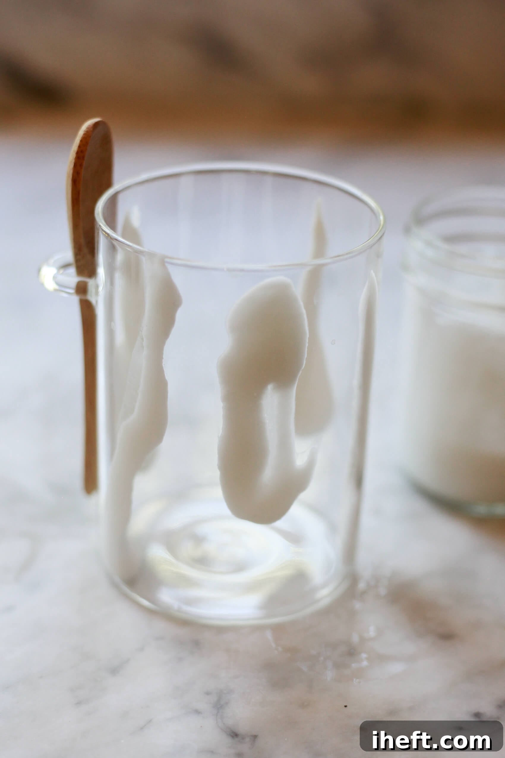 Coconut cream stripes along the inside of a glass. How to create coconut cream smoothie swirls.