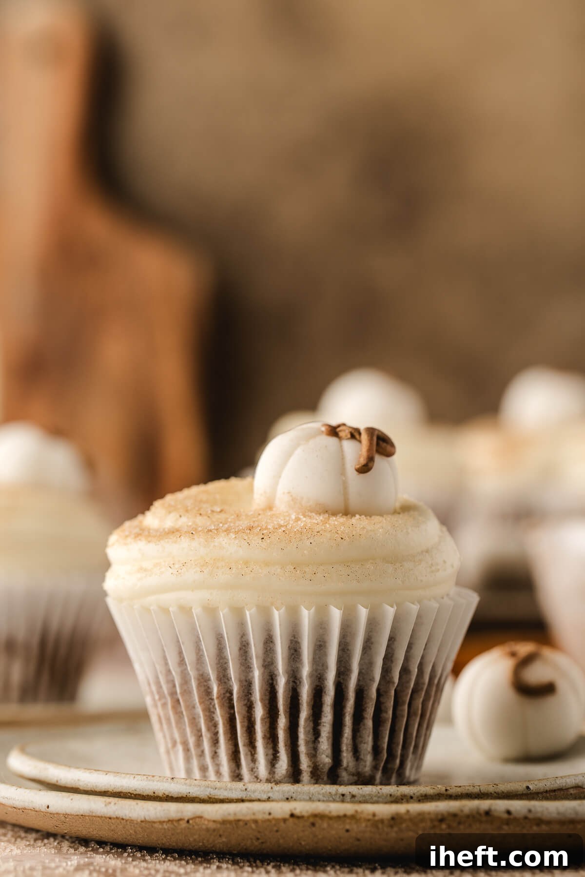 Cute pumpkin cupcakes with white fondant pumpkins are perfect for Halloween. 