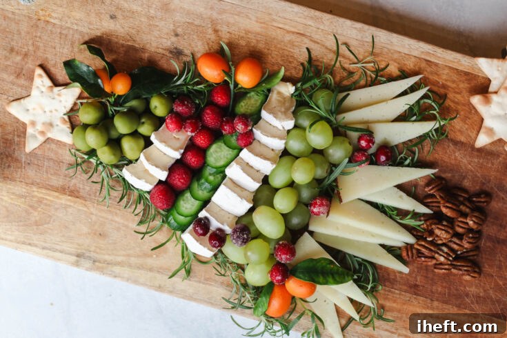 Close-up of the Christmas Tree Charcuterie Board, featuring a star cracker, rosemary, and colorful fruits, perfect for a holiday Pinterest pin.