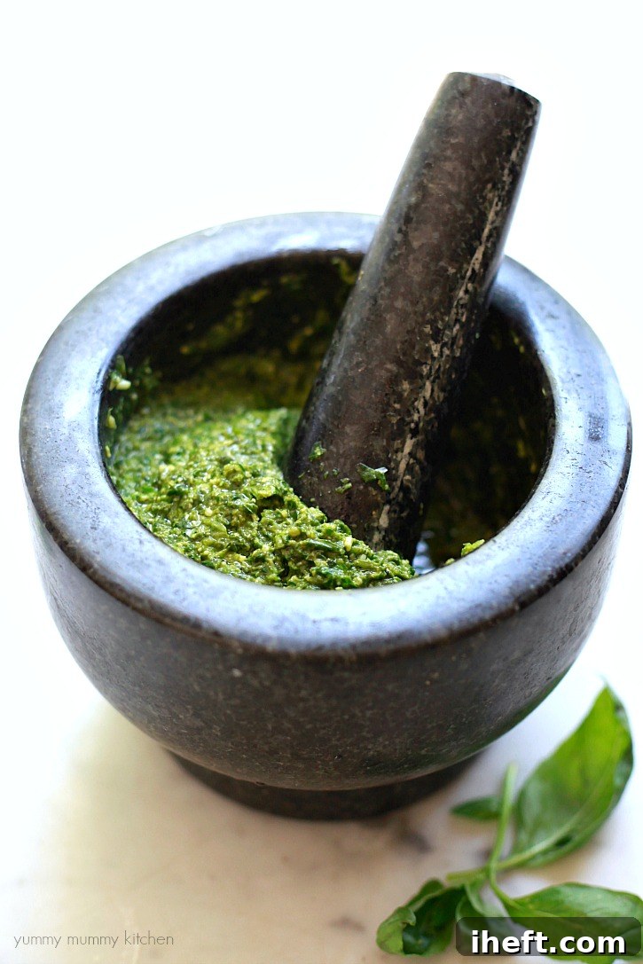 Beautiful traditional pesto alla Genovese recipe made with fresh basil and a mortar and pestle. 