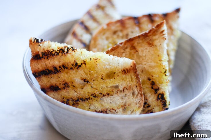Grilled Italian bread with olive oil for authentic bruschetta.