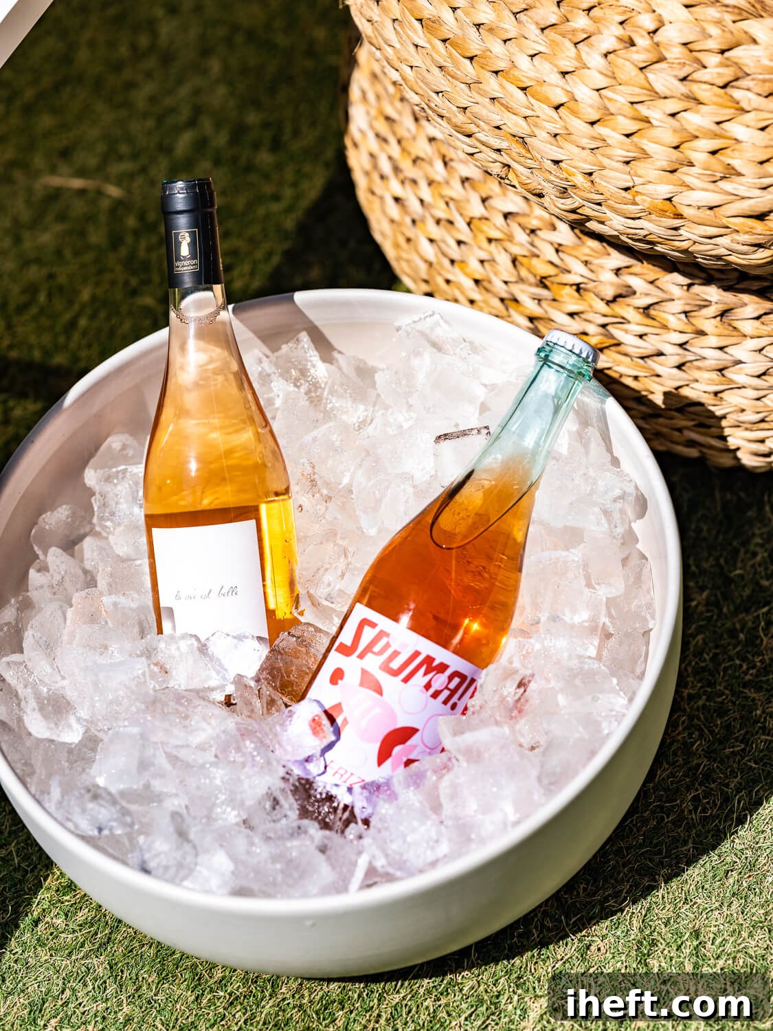 Two elegant bottles of rosé wine from Dry Farms Wine nestled in a sleek ice bucket, ready to be chilled and enjoyed.