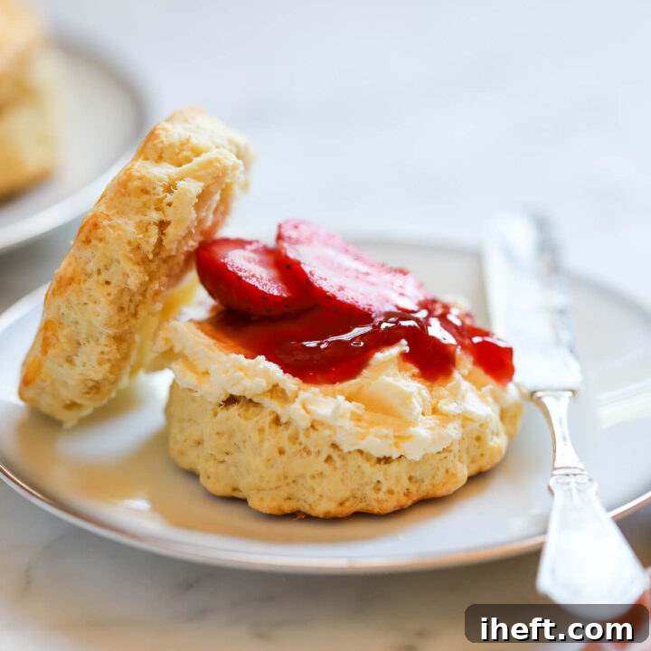 A beautifully arranged selection of English Scones, ready to be served with clotted cream and jam, central to any traditional Afternoon Tea.