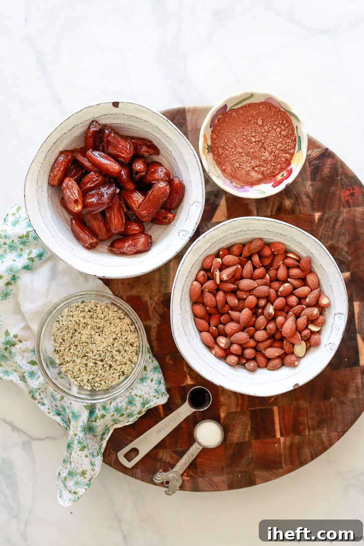 Key ingredients for homemade bliss balls: dates, cacao powder, almonds, vanilla extract, and hemp hearts, all contributing to a healthy and delicious snack.