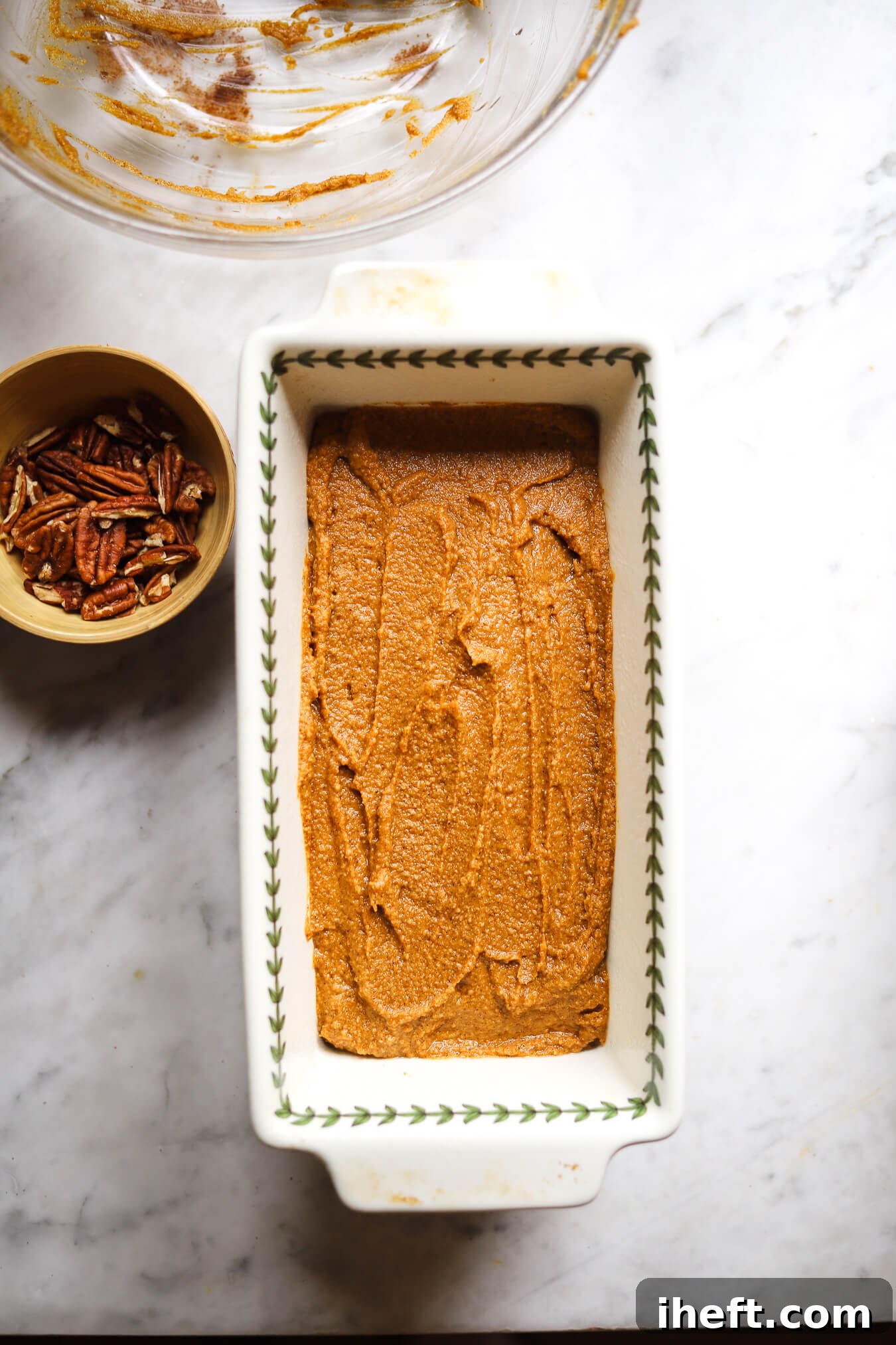 Pumpkin bread batter in a loaf pan before baking.
