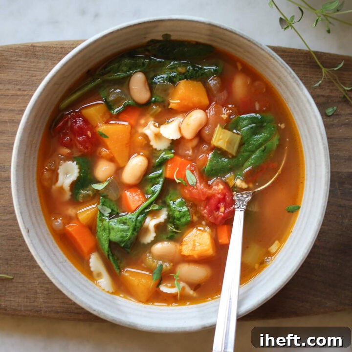 A bowl of Ina Garten's recipe for Winter Minestrone in a ceramic bowl.