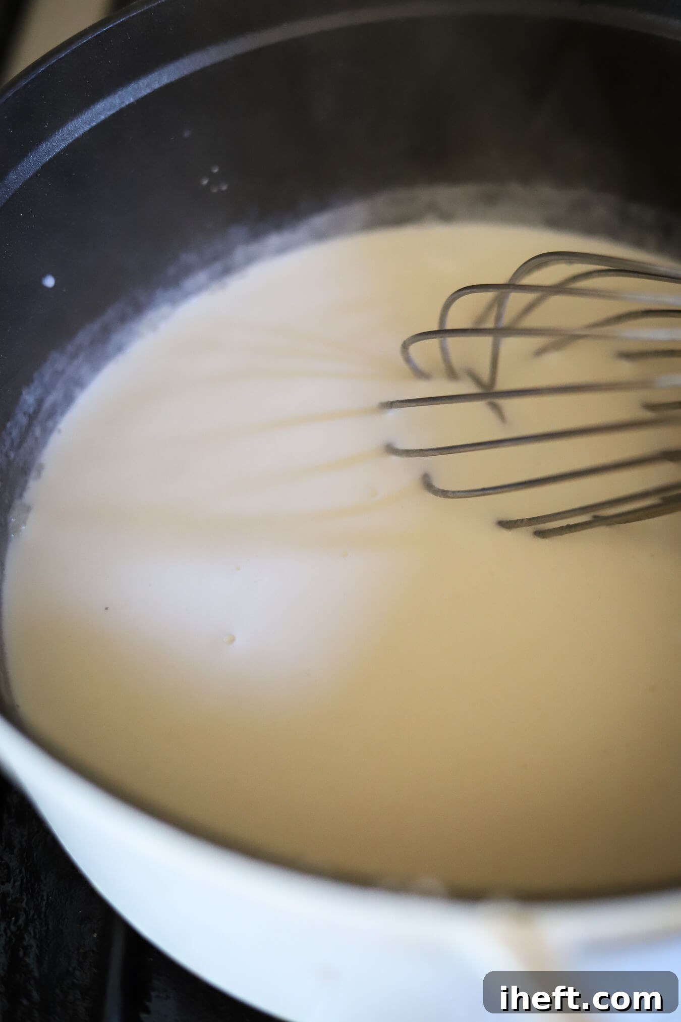 Whisking sauce for mac and cheese