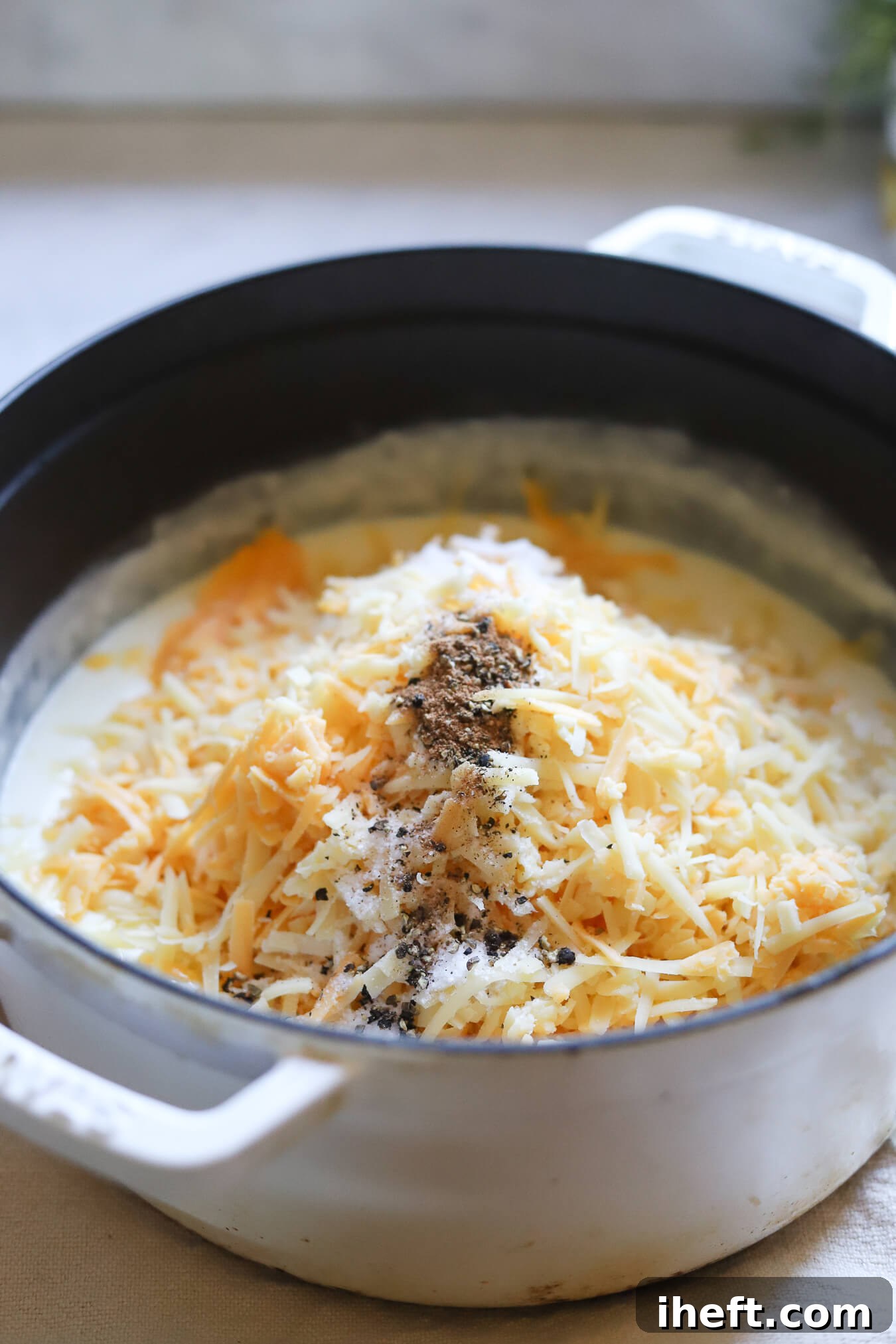 Shredded cheeses added to make sauce for mac and cheese.