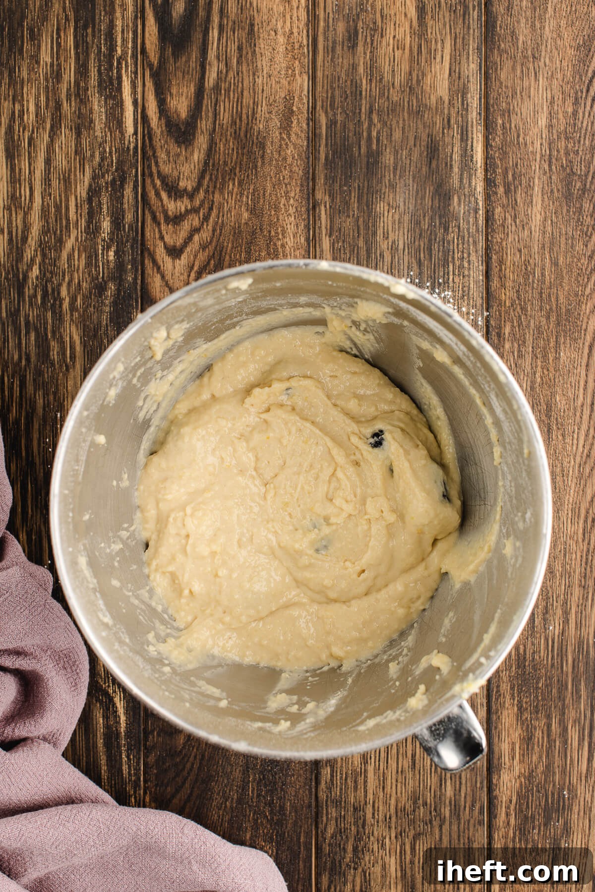 Flour-coated blackberries are added to coffee cake batter in a stand mixer.