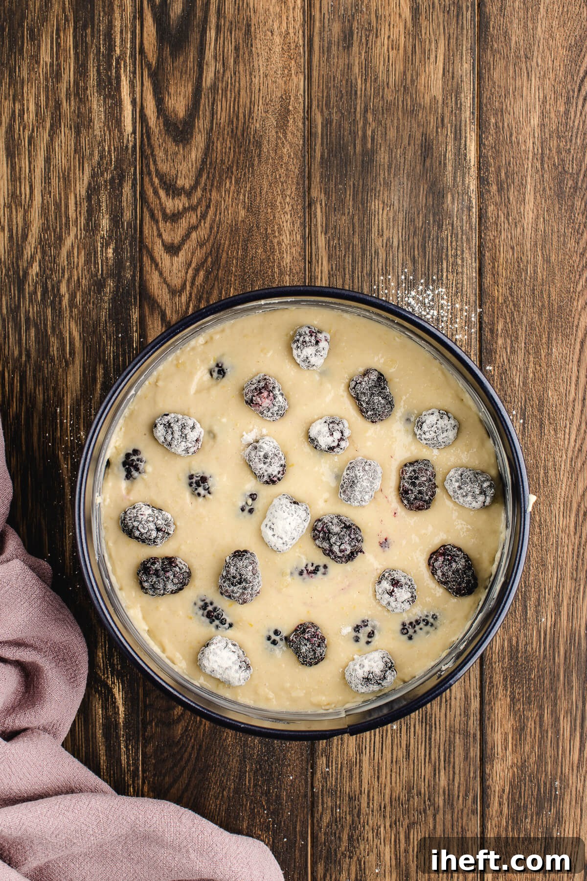 Blackberry coffee cake batter in a springform pan before baking.