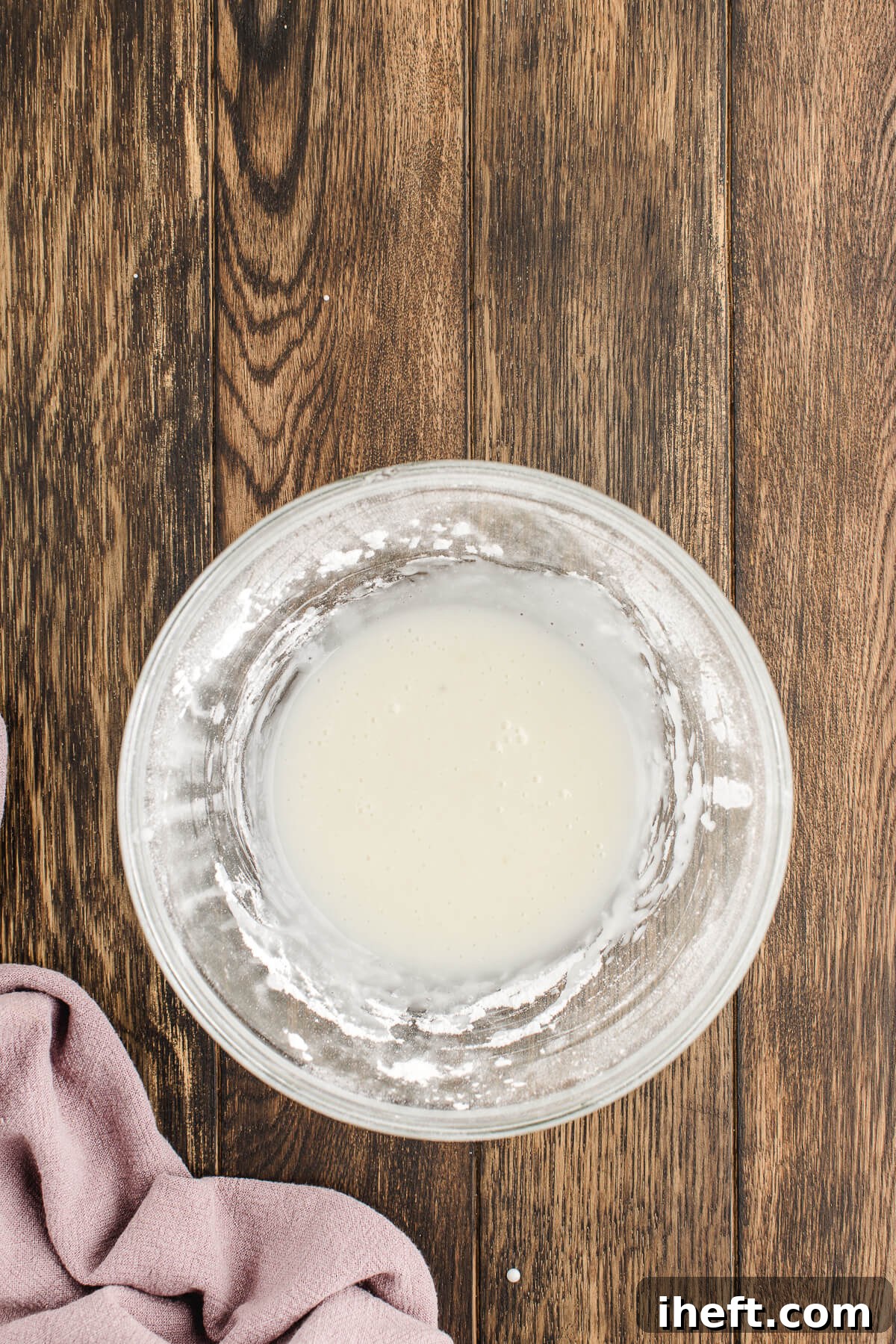 Lemon glaze in a medium glass bowl.