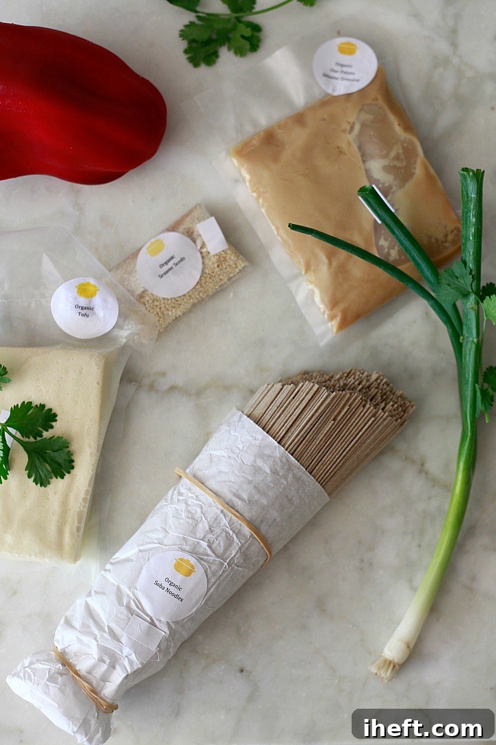 A beautifully arranged selection of organic ingredients from One Potato Box, ready for meal preparation, highlighting fresh produce and quality proteins