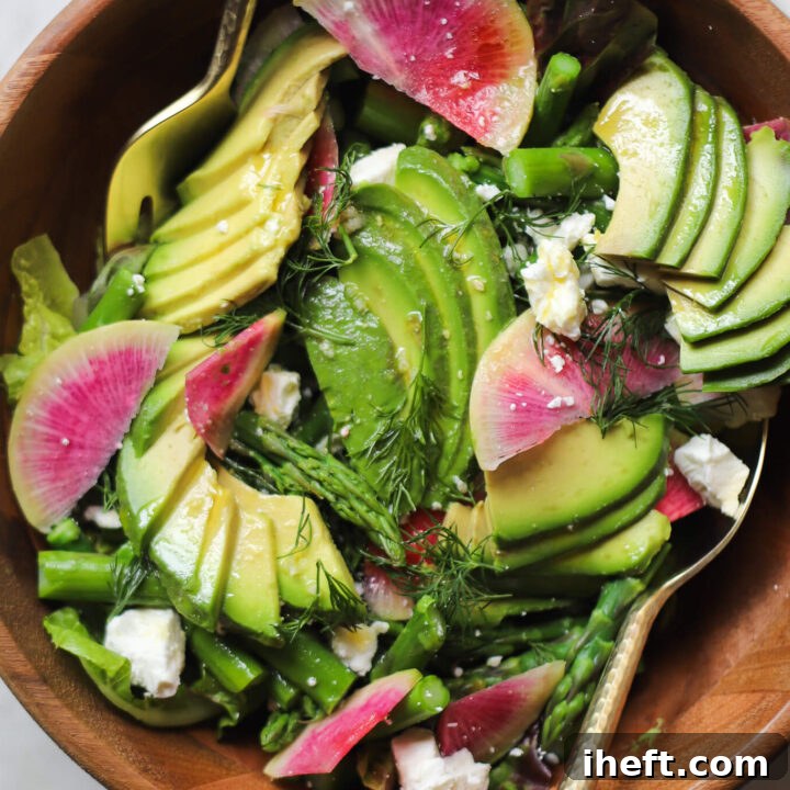 A beautiful spring salad with asparagus, avocado, feta, and radish.