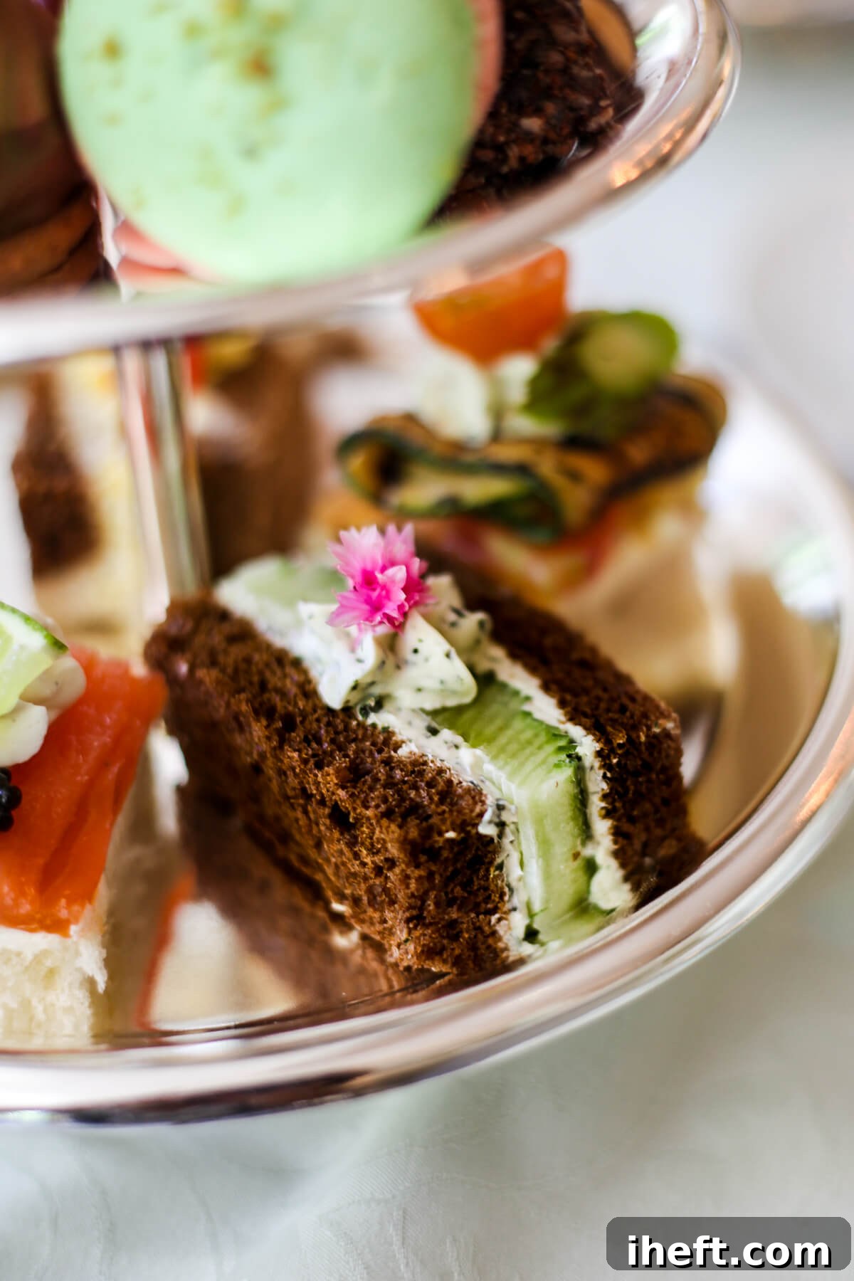 A beautiful cucumber cream cheese English tea sandwich on an afternoon tea platter. 