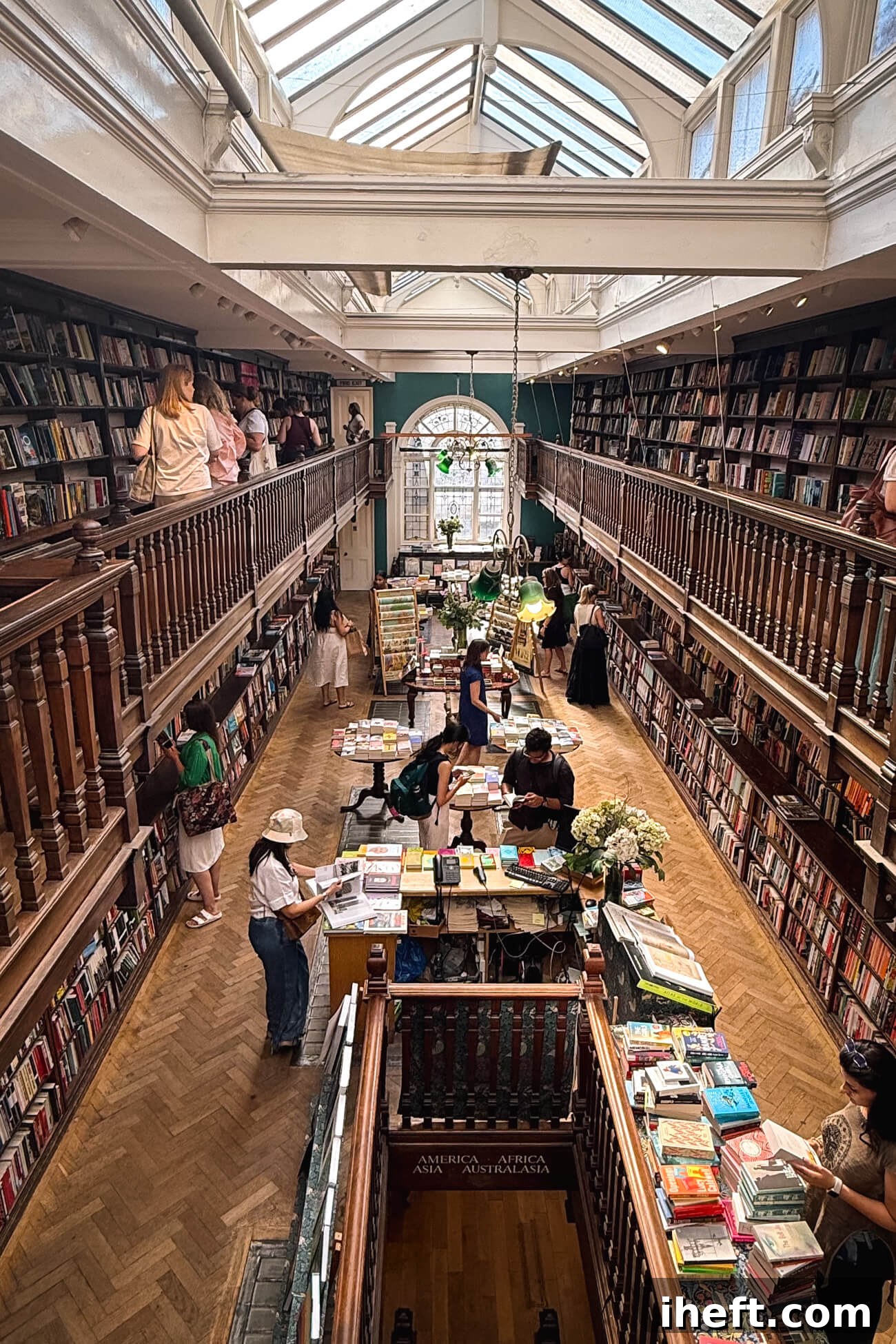 The stunning interior of Daunt Books in Marylebone London, an Edwardian-style bookstore with impressive oak galleries and skylights, widely regarded as one of the most beautiful bookstores in the world.