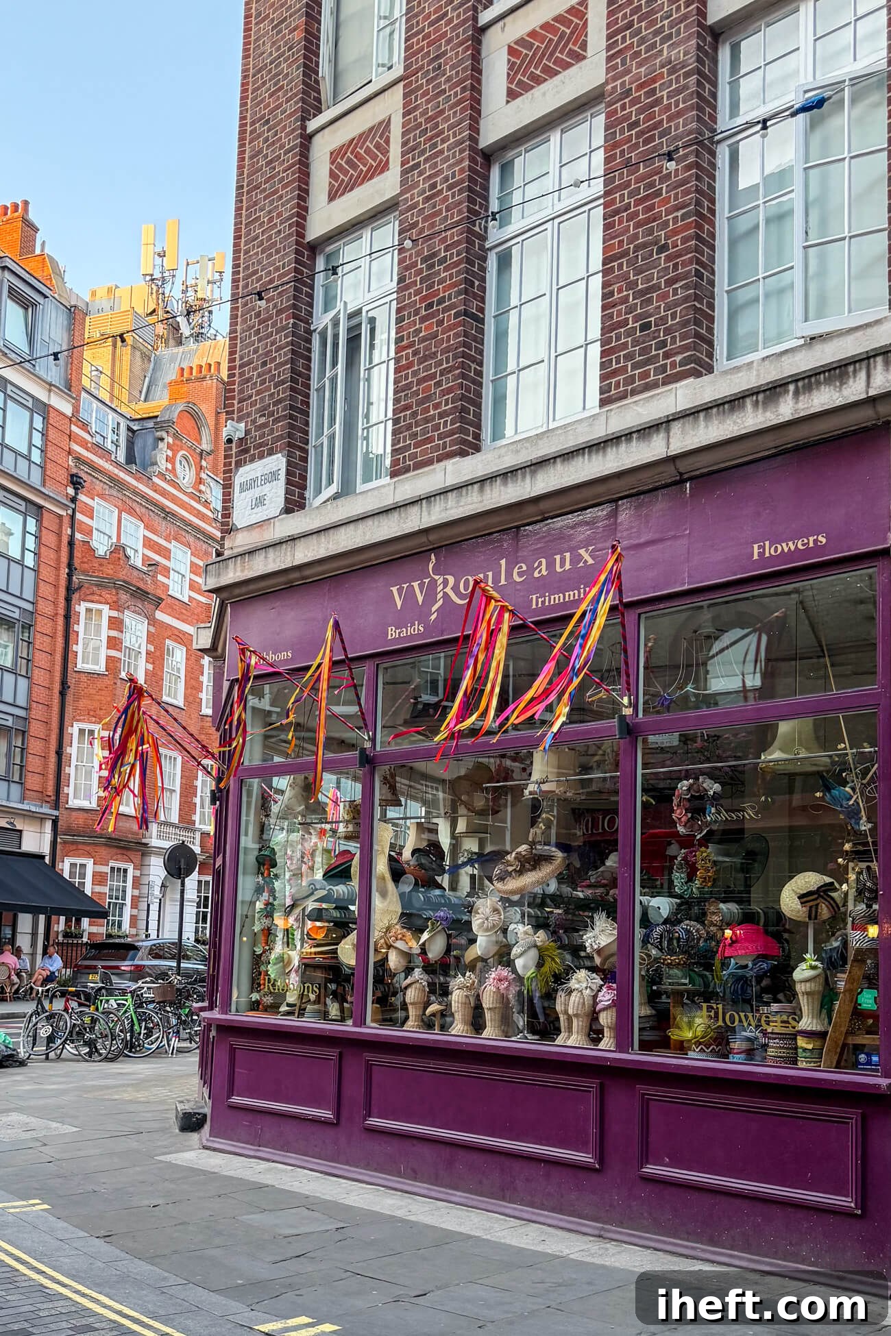 The charming exterior of VV Rouleaux, a classic Marylebone shop adorned with ribbons and showcasing proper English headbands and Ascot Hats, located on Marylebone Lane.