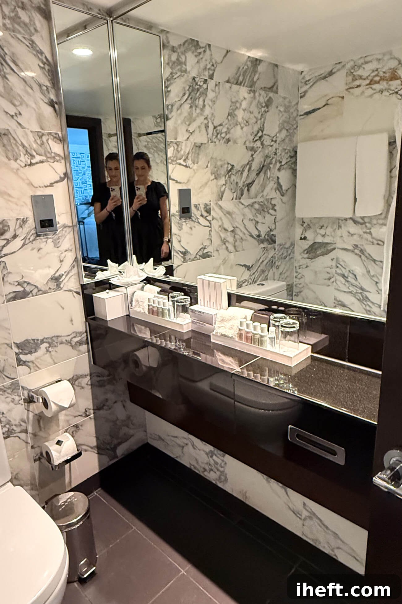 A marble bathroom shown as a Marylebone hotel review. 