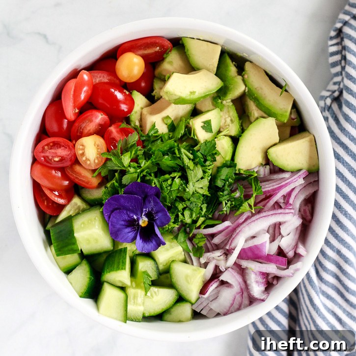 An easy avocado salad recipe featuring fresh ingredients like cucumber, tomatoes, and creamy avocado, perfect for a quick and healthy meal or side dish.