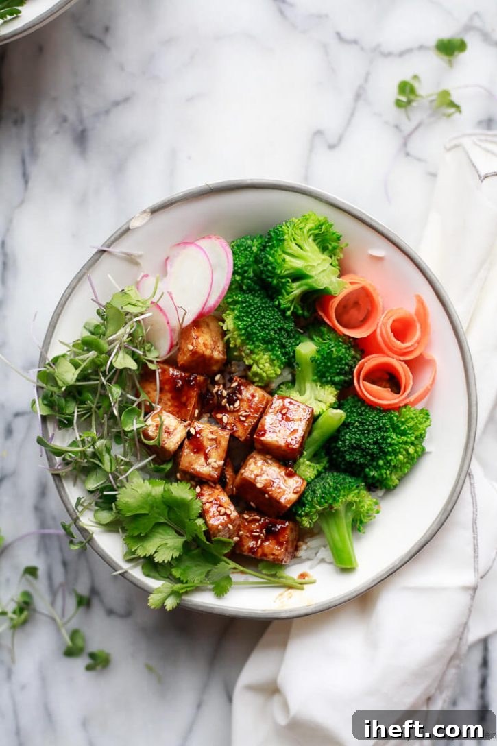 Crispy Easy Baked Tofu with a sticky ginger soy sauce glaze, perfect for a quick and healthy meal.