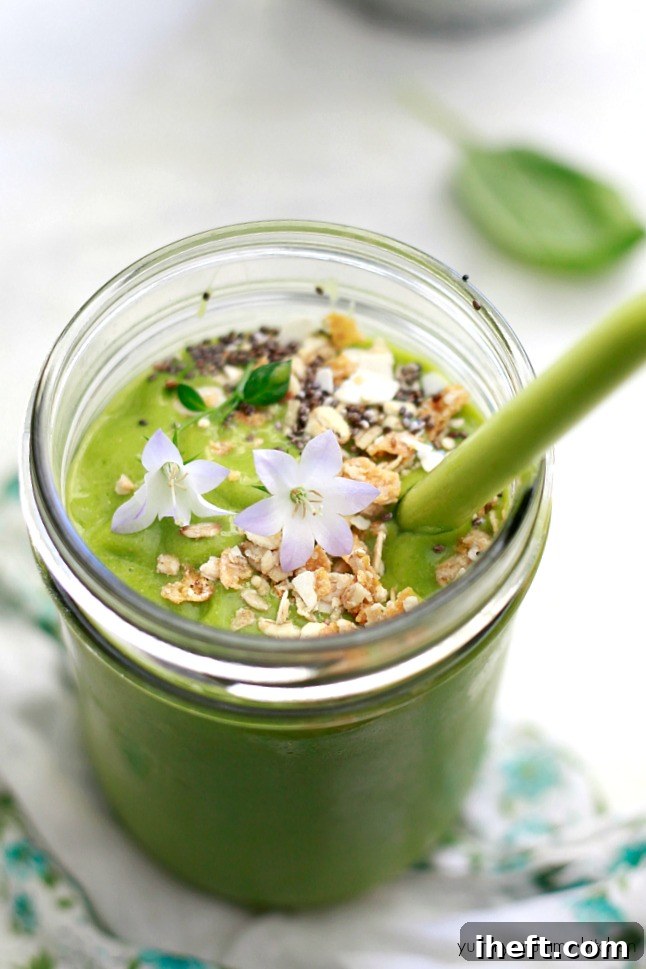 Exquisite tropical green and glowing smoothie recipe, a vegan delight featuring pineapple, mango, coconut, flax, and fresh baby spinach for peak nutrition and flavor, inspired by Whole Foods.