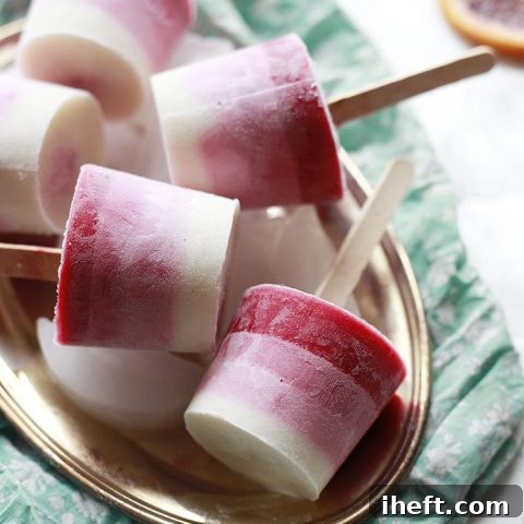 Ombre Berry Orange Yogurt Ice Pops, a vibrant and healthy frozen dessert recipe.