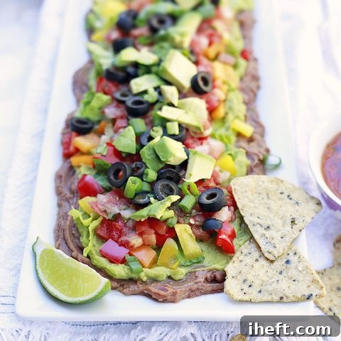 Vegetarian Layered Bean Dip, a healthy and colorful party appetizer.