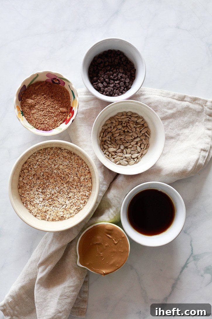 Essential ingredients for crafting delicious no-bake energy balls, including certified gluten-free oats, omega-rich flax meal, creamy sunflower seed butter, and natural maple syrup.