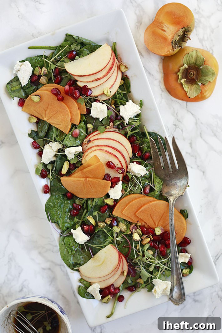 Autumn salad with fresh persimmons and crisp apples, a perfect fall dish