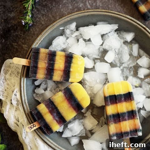 Beautifully crafted black and orange Halloween popsicles ready to be served