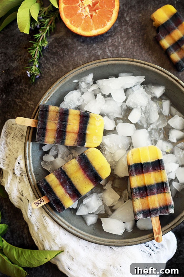 Pin this recipe for natural black and orange Halloween popsicles