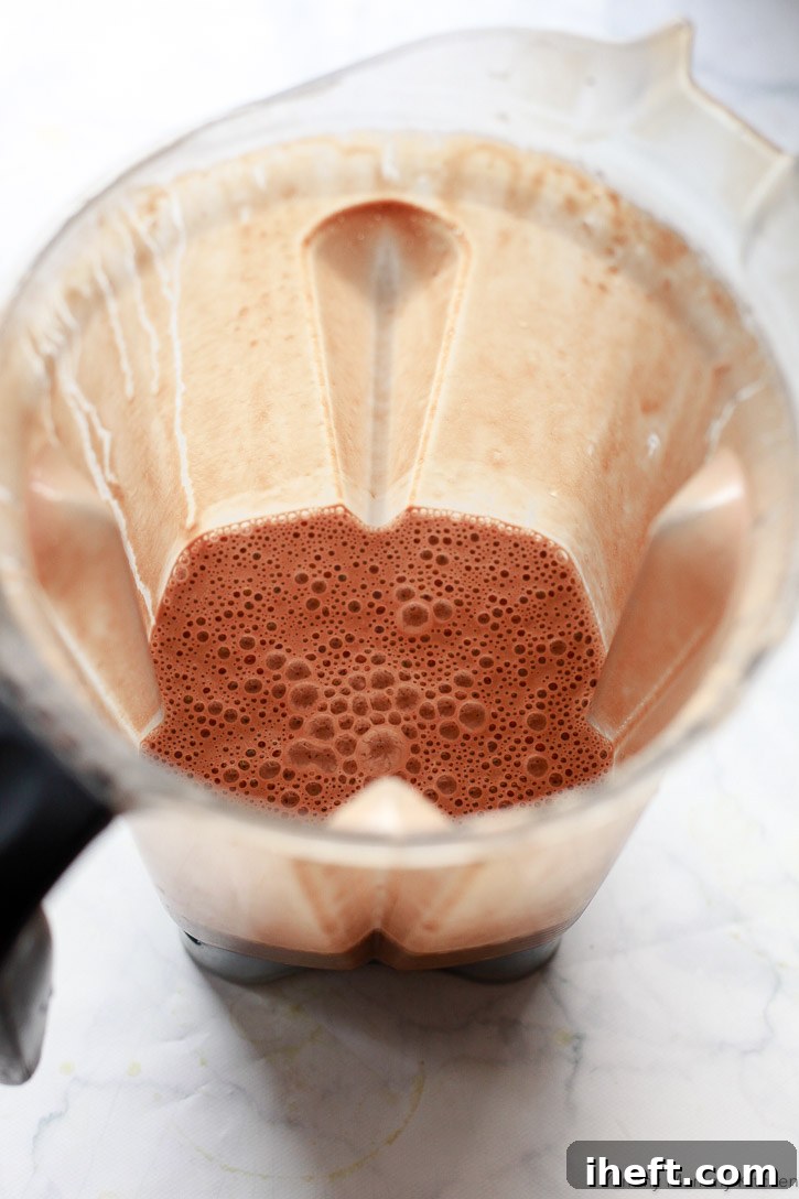 This easy vegan and paleo hot cocoa is crafted with a few natural ingredients and blended seamlessly in a high-speed blender.