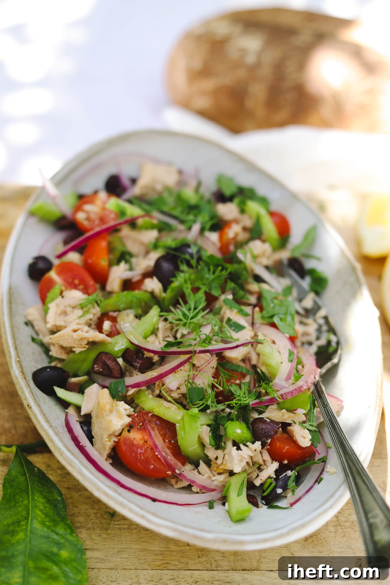 Mediterranean Tuna Salad with Sourdough Mediterranean tuna salad with albacore tuna, cherry tomatoes, kalamata olives, celery, red onion, and parsley served with crusty sourdough bread.