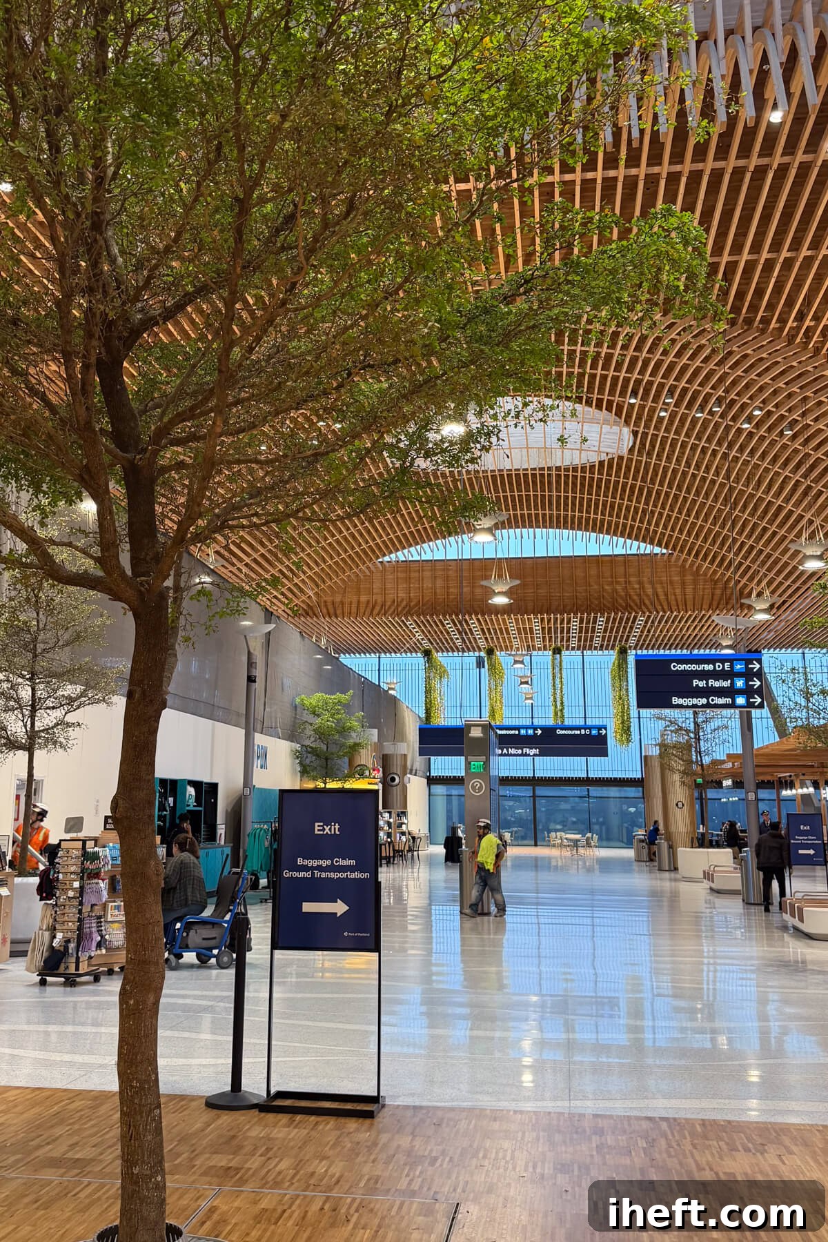 The inside of the Portland Oregon airport with trees.